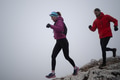 Athlete couple trail running on the mountain top in the early morning. Sky running concept - PhotoDune Item for Sale