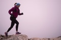 sky running or trail running woman exercising on a mountain top - PhotoDune Item for Sale