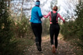trail running with a sporty couple in the magic forest in early morning - PhotoDune Item for Sale