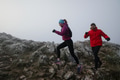 trail running couple man and woman running on a mountain path - PhotoDune Item for Sale
