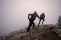 trail running couple man and woman running on a mountain path - PhotoDune Item for Sale