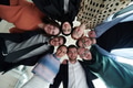A diverse group of business professionals standing together in a powerful, united pose, captured - PhotoDune Item for Sale