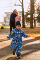 A joyful little boy in his winter coat and hat plays happily in the park, surrounded by the love and - PhotoDune Item for Sale