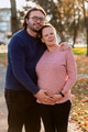 A man lovingly embraces his pregnant wife in the park, sharing a peaceful moment of warmth and - PhotoDune Item for Sale