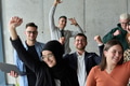 A diverse team of business professionals ecstatically celebrating their success in a modern office - PhotoDune Item for Sale