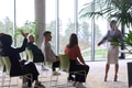 A businesswoman leader guiding a meeting with her colleagues, discussing business challenges - PhotoDune Item for Sale
