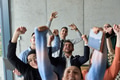 A diverse team of business professionals ecstatically celebrating their success in a modern office - PhotoDune Item for Sale