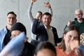 A diverse team of business professionals ecstatically celebrating their success in a modern office - PhotoDune Item for Sale