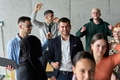 A diverse team of business professionals ecstatically celebrating their success in a modern office - PhotoDune Item for Sale