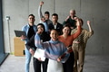 A diverse team of business professionals ecstatically celebrating their success in a modern office - PhotoDune Item for Sale