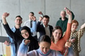 A diverse team of business professionals ecstatically celebrating their success in a modern office - PhotoDune Item for Sale