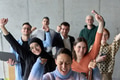 A diverse team of business professionals ecstatically celebrating their success in a modern office - PhotoDune Item for Sale