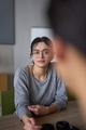 A close up portrait of a young businesswoman engaged in a professional meeting, confidently - PhotoDune Item for Sale
