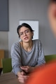 A close up portrait of a young businesswoman engaged in a professional meeting, confidently - PhotoDune Item for Sale