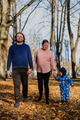 A loving couple strolls through a sunlit park with their young son, surrounded by the vibrant colors - PhotoDune Item for Sale