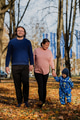 A loving couple strolls through a sunlit park with their young son, surrounded by the vibrant colors - PhotoDune Item for Sale