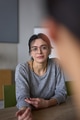 A close up portrait of a young businesswoman engaged in a professional meeting, confidently - PhotoDune Item for Sale