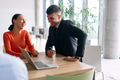A young, diverse business team sitting together in a modern office, exchanging ideas and business - PhotoDune Item for Sale