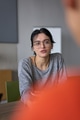 A close up portrait of a young businesswoman engaged in a professional meeting, confidently - PhotoDune Item for Sale