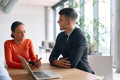 A young, diverse business team sitting together in a modern office, exchanging ideas and business - PhotoDune Item for Sale