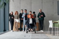 A diverse group of business professionals walking together through the office, symbolizing unity and - PhotoDune Item for Sale