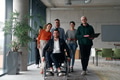 A diverse group of business professionals walking together through the office, symbolizing unity and - PhotoDune Item for Sale