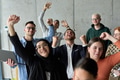 A diverse team of business professionals ecstatically celebrating their success in a modern office - PhotoDune Item for Sale