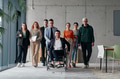 A diverse group of business professionals walking together through the office, symbolizing unity and - PhotoDune Item for Sale