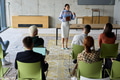 A businesswoman leader guiding a meeting with her colleagues, discussing business challenges - PhotoDune Item for Sale