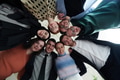 A diverse group of business professionals standing together in a powerful, united pose, captured - PhotoDune Item for Sale