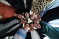 A diverse group of business professionals standing together in a powerful, united pose, captured - PhotoDune Item for Sale