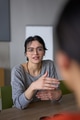 A close up portrait of a young businesswoman engaged in a professional meeting, confidently - PhotoDune Item for Sale