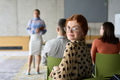A diverse group of business professionals sits attentively in a modern office, actively - PhotoDune Item for Sale