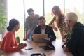 A diverse team of business professionals, along with the company director, reviewing business - PhotoDune Item for Sale
