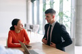 A young, diverse business team sitting together in a modern office, exchanging ideas and business - PhotoDune Item for Sale