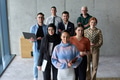 A diverse and determined team of business professionals stands confidently in an office, ready to - PhotoDune Item for Sale