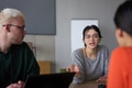 A young, diverse business team sitting together in a modern office, exchanging ideas and business - PhotoDune Item for Sale
