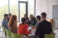 A young, diverse business team sitting together in a modern office, exchanging ideas and business - PhotoDune Item for Sale