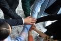 A top view of business people joining hands in a circle, symbolizing unity, collaboration, and - PhotoDune Item for Sale