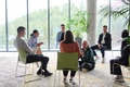 Corporate business team meeting with a manager or coach. Group of happy diverse, multiracial people - PhotoDune Item for Sale