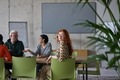 A young, diverse business team sitting together in a modern office, exchanging ideas and business - PhotoDune Item for Sale