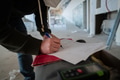 A close-up of an engineer's hand meticulously sketching an architectural project, capturing the - PhotoDune Item for Sale