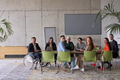 A diverse group of business professionals sitting in an office meeting with their director, who is - PhotoDune Item for Sale