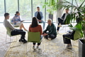 Corporate business team meeting with a manager or coach. Group of happy diverse, multiracial people - PhotoDune Item for Sale