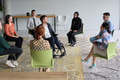 Corporate business team meeting with a manager or coach. Group of happy diverse, multiracial people - PhotoDune Item for Sale