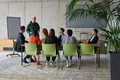 A young, diverse business team sitting together in a modern office, exchanging ideas and business - PhotoDune Item for Sale