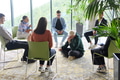 Corporate business team meeting with a manager or coach. Group of happy diverse, multiracial people - PhotoDune Item for Sale