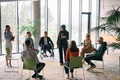 Corporate business team meeting with a manager or coach. Group of happy diverse, multiracial people - PhotoDune Item for Sale