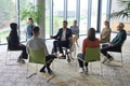 Corporate business team meeting with a manager or coach. Group of happy diverse, multiracial people - PhotoDune Item for Sale