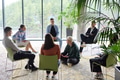 Corporate business team meeting with a manager or coach. Group of happy diverse, multiracial people - PhotoDune Item for Sale